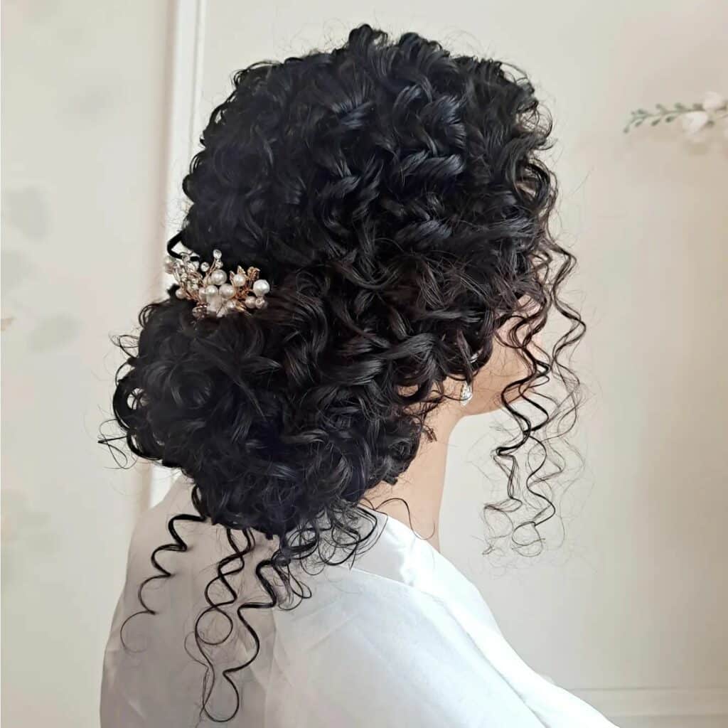 sophisticated updo with curls for prom
