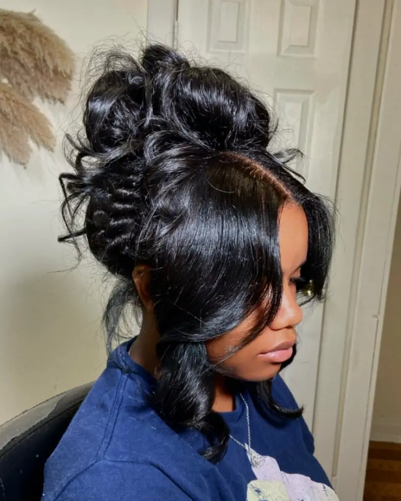 voluminous high bun with a side braid prom hairstyle for black girls
