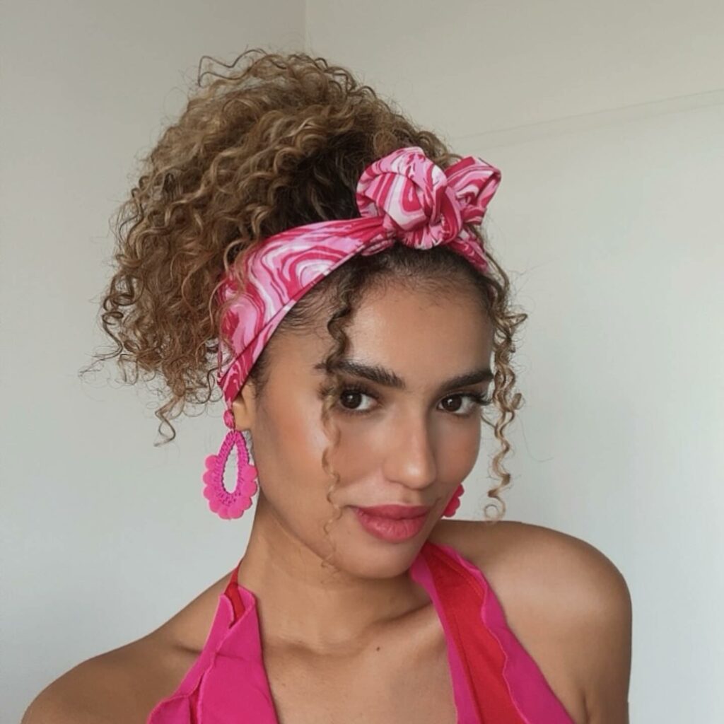 Playful high ponytail with natural curls