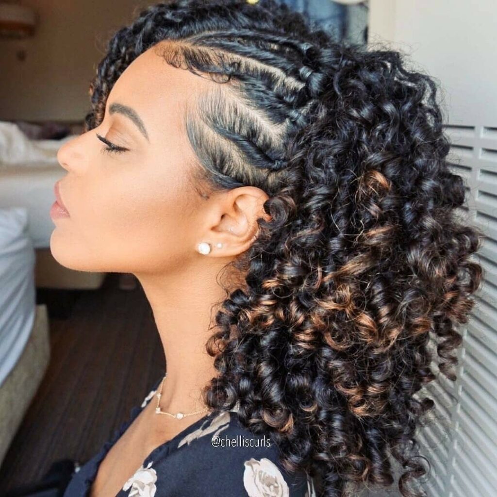 side cornrows with a free-flowing curly ponytail