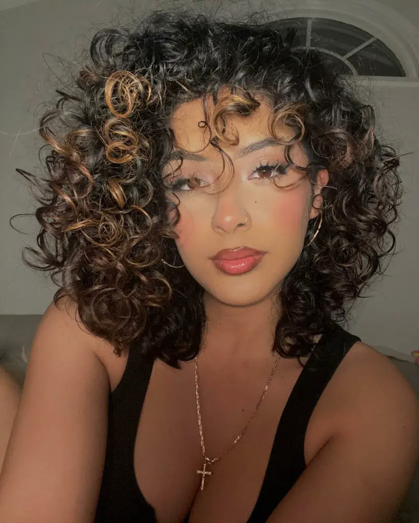 stunning medium-length curly shag with bangs