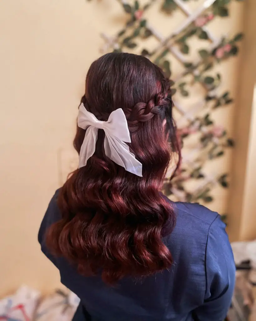 Braided Half-Up with Bow hairstyles for graduation 2024