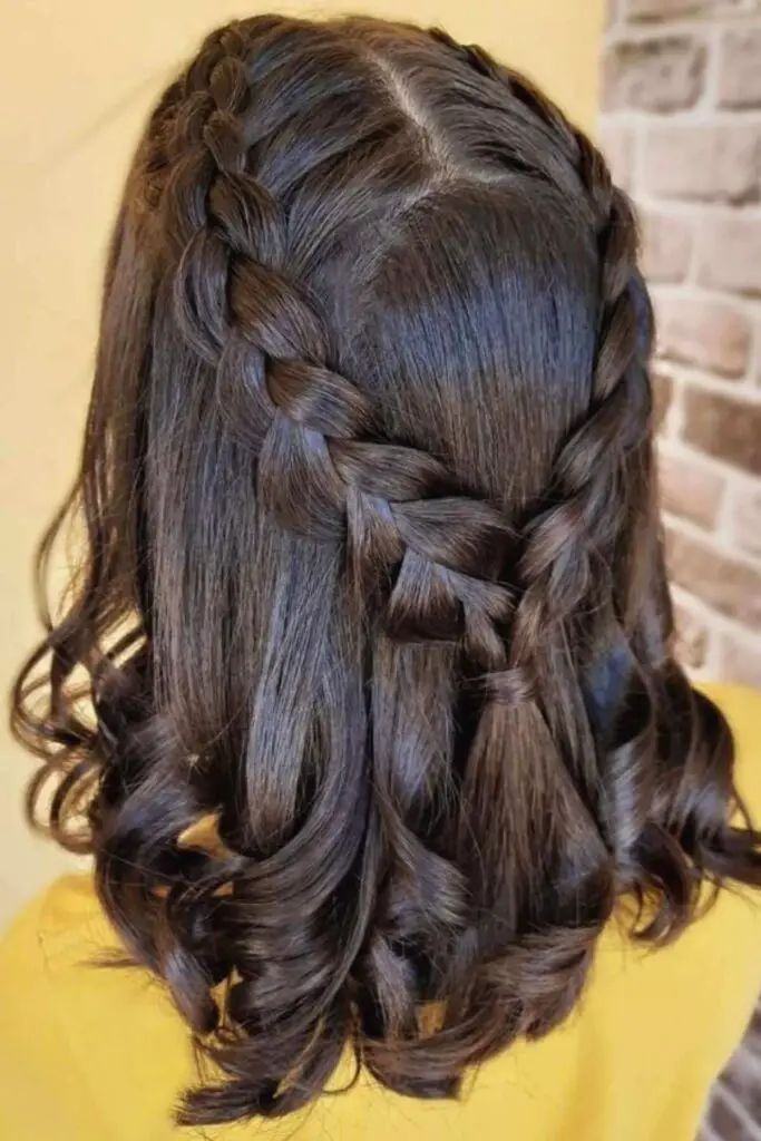 Cute and chic braided half-updo for short hair, proving that braids work beautifully on any hair length.