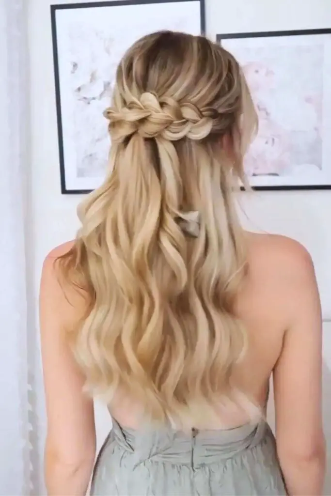 Delicate waterfall braid cascading into soft waves, creating a dreamy and feminine hairstyle for special occasions.